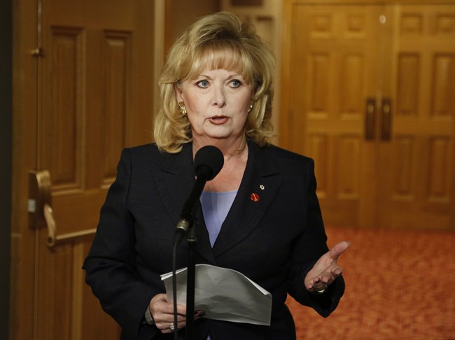 Senator Pamela Wallin speaks to reporters outside a Senate committee hearing on Parliament Hill in Ottawa on Monday, August 12, 2013. THE CANADIAN PRESS/ Patrick Doyle.