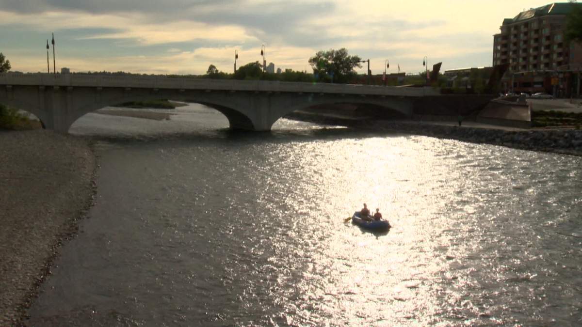 A group of rafters float along the Bow River in Calgary.