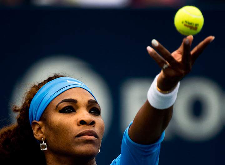 Serena Williams of the United States serves the ball against Sorana Cirstea of Romania during singles championship women's Rogers Cup tennis action in Toronto on Sunday, August 11, 2013. 