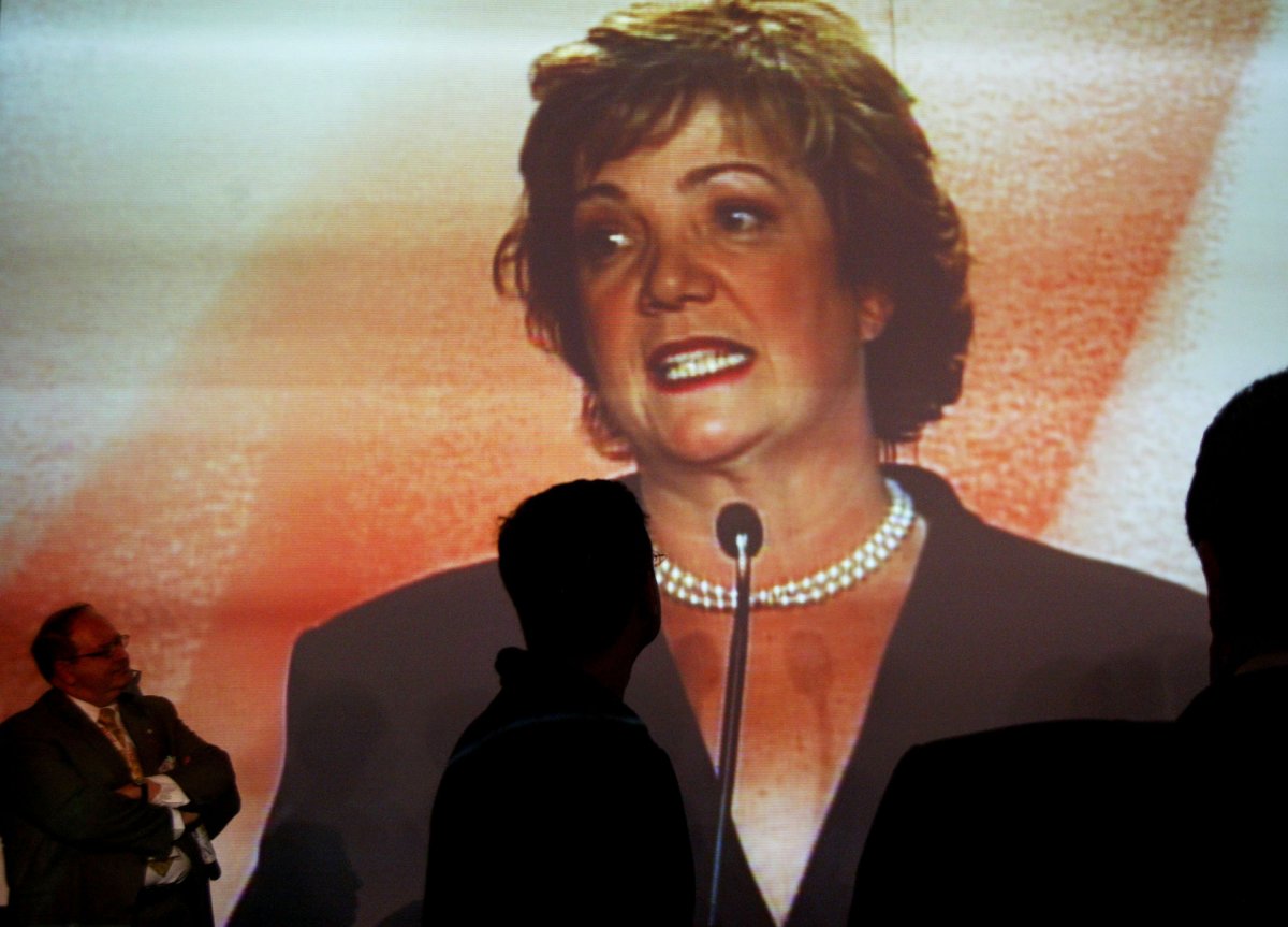 People watch a video monitor of leadership candidate Sheila Copps speaking during the 2003 Leadership and Biennial Convention November 14, 2003 in Toronto.