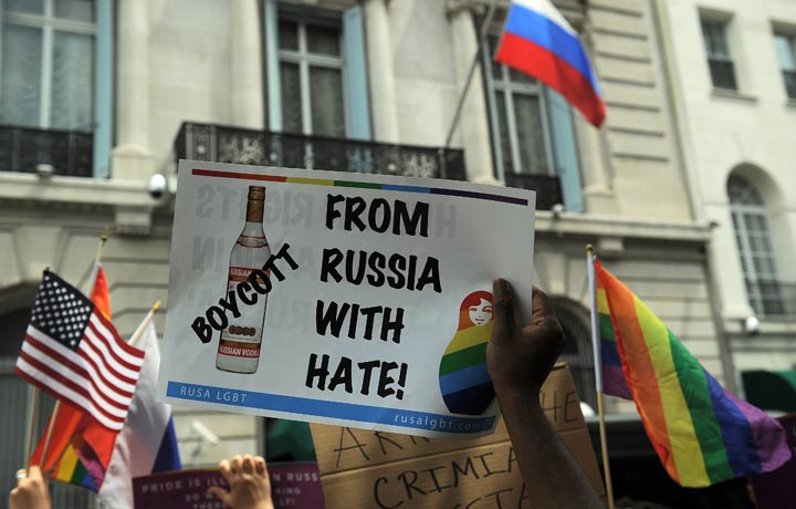 Protesters hold a demonstration against Russian anti-gay legislation and against Russian President Vladimir Putin stands on gay rights, in front of the Russian Consulate in New York, July 31, 2013. 