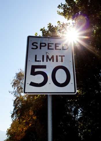 Speed limit sign sun flare outside 50 mph.