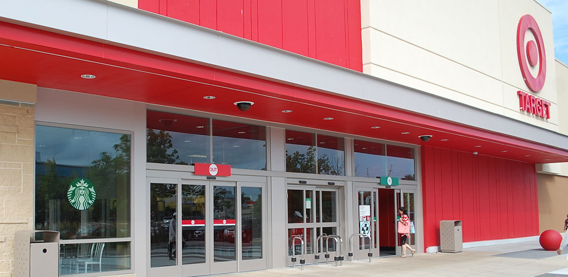 Starbucks and Target are each well-positioned to weather a slowdown in consumer spending, market watchers say. 