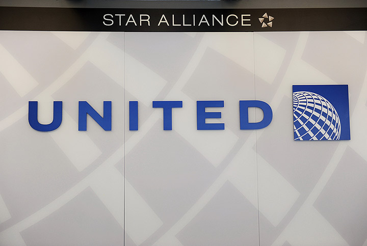 In this FILE photo, a United Airlines logo is seen behind the ticket counter at Chicago's O'Hare airport on August 13, 2013.