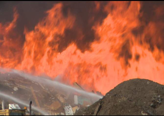 Firefighters leaving landfill blaze - image