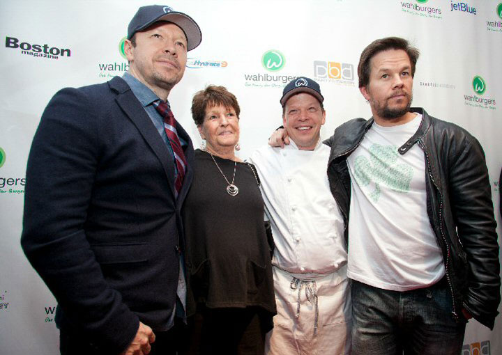 Donnie Wahlberg (left) and brothers Paul Wahlberg and Mark Wahlberg pose with their mother Alma.