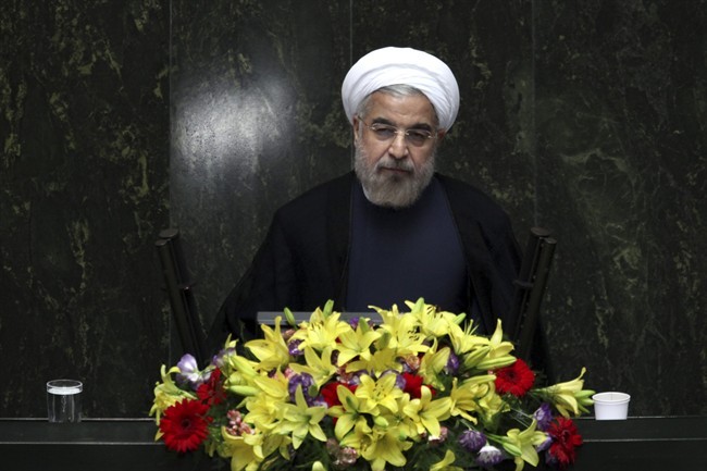FILE - In this Aug. 15, 2013, file photo, Iranian President Hasan Rouhani speaks during the debate on the proposed Cabinet at the parliament, in Tehran, Iran.The U.N. has slotted the new moderate-leaning president to address the global gathering of leaders on Sept. 24 - just hours after U.S. President Barack Obama is scheduled to wrap up his speech. 