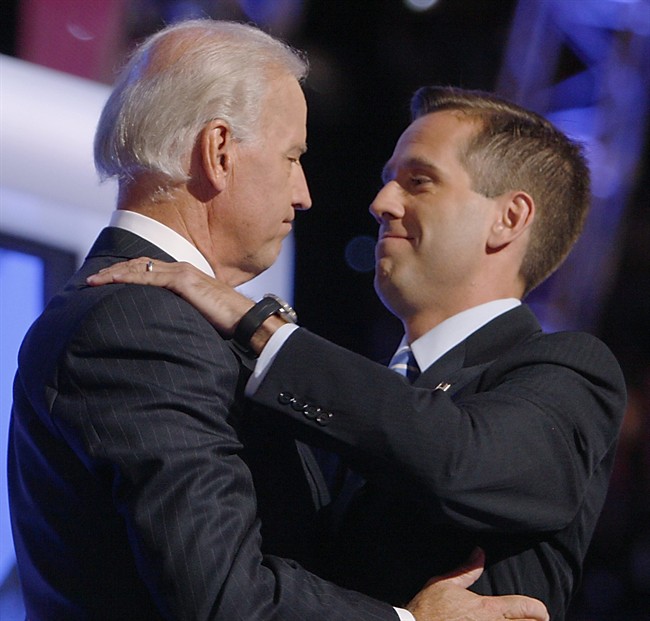 FILE - In this Aug. 27, 2008, file photo, then-Democratic vice presidential candidate Sen. Joe Biden, D-Del., left, embraces his son Beau on stage at the Democratic National Convention in Denver.