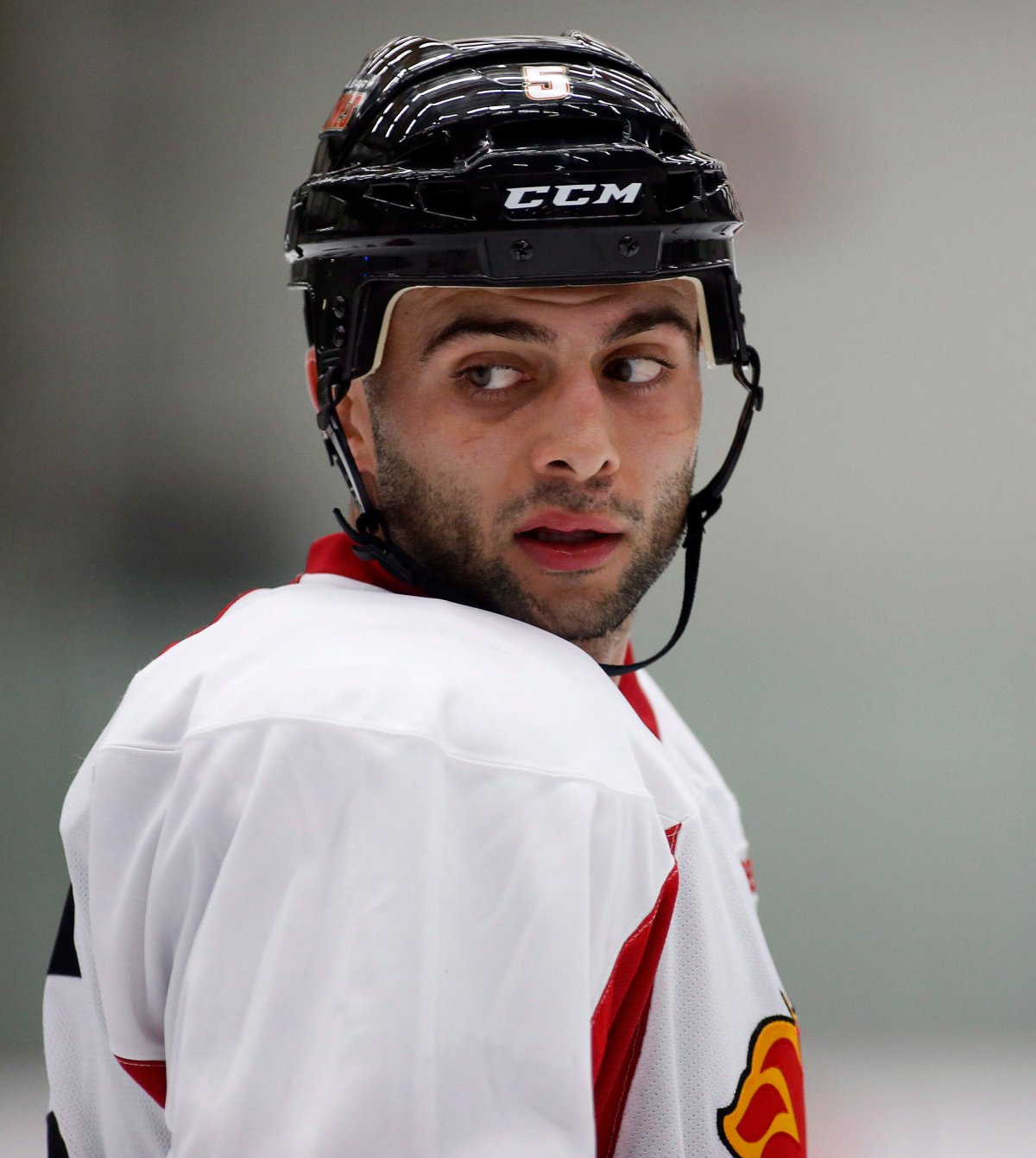 Calgary Flames' Mark Giordano looks over his shoulder during training camp in Calgary, Alta., Thursday, Sept. 12, 2013.