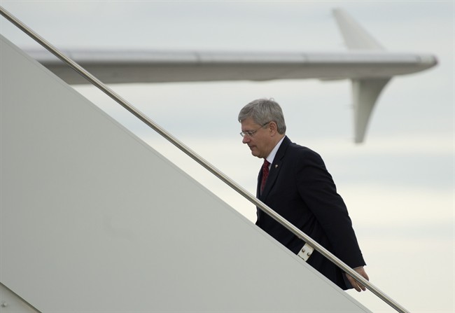 Canadian Prime Minister Stephen Harper boards the Canadian Forces plane in Ottawa, on Wednesday September 4, 2013. 