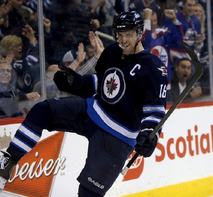 Andrew Ladd scored both Jets goals in a 3-2 overtime loss to the Islanders.