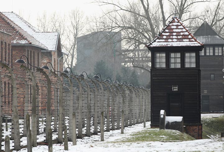 A guard tower stands next to a perimeter fence at the Auschwitz I memorial and former concentration camp on the 66th anniversary of the liberation of Auschwitz in this January 27, 2011 file photo. 