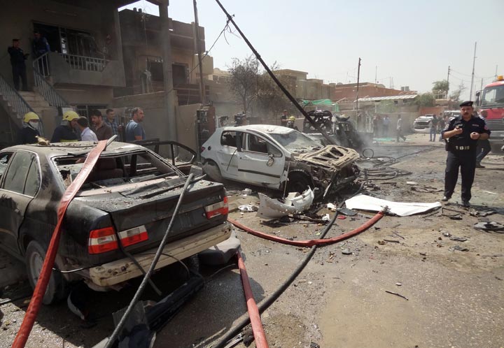 Police officials say three bombs went off on Thursday as the market in the Shiite village of Sabaa al-Bour was packed with shoppers. The village is about 30 kilometres (20 miles) north of Baghdad.
