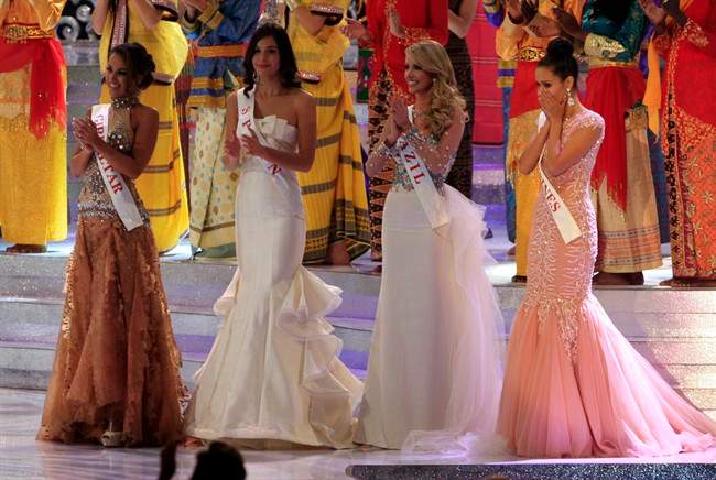 Miss Philippine Megan Young, right, reacts after winning the Miss World pageant final in Nusa Dua, Bali, Indonesia, Saturday, Sept. 28, 2013.