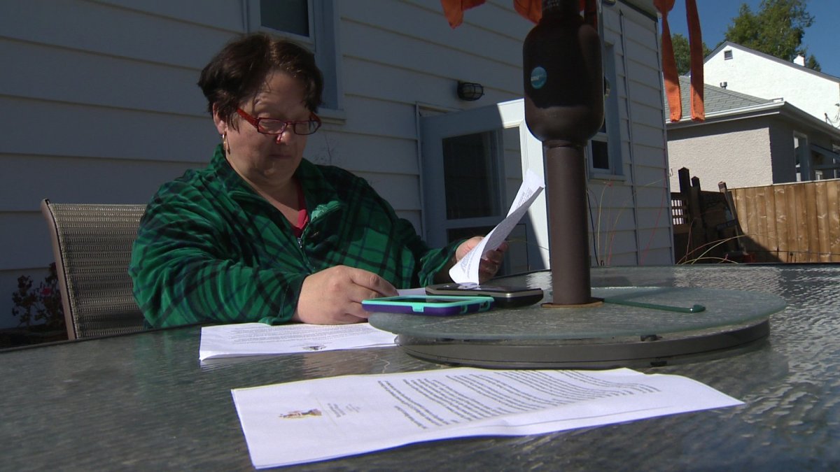Barbara Judt reviews provincial documents on Saturday.