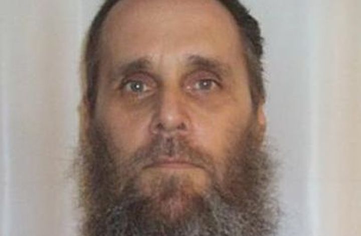 Benton is described as white male, six feet tall, 197 pounds, with brown hair and green eyes.