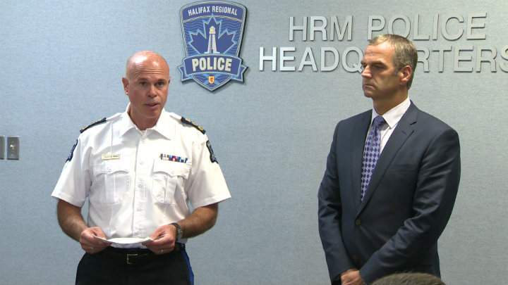 Eric Richards is recognized by Halifax Regional Police Chief Jean-Michel Blais for his efforts to rescue a man who had fallen into the Halifax harbour.