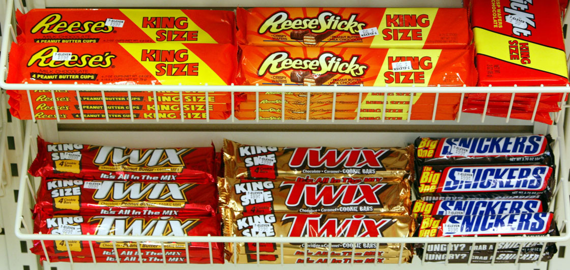 The biggest makers of candy bars in the country have agreed to pay $23.2 million to settle a class-action lawsuit alleging they colluded to keep prices high.