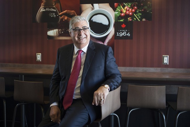Marc Caira, Tim Hortons new CEO, poses for a picture in one of the company's coffee shops in Oakville, Ontario on Monday September 16, 2013. THE CANADIAN PRESS/Chris Young