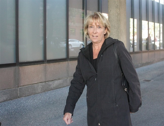 Nicki Smith, deputy warden at Grand Valley Institution in Kitchener, Ont., leaves the inquest into the choking death of Ashley Smith in Toronto on Monday, Sept. 23, 2013. 