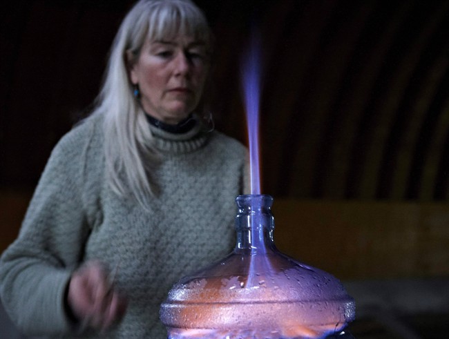 Oil patch consultant Jessica Ernst burns off some of the methane that is in her well water in Rosebud, Alta., June 2, 2011.