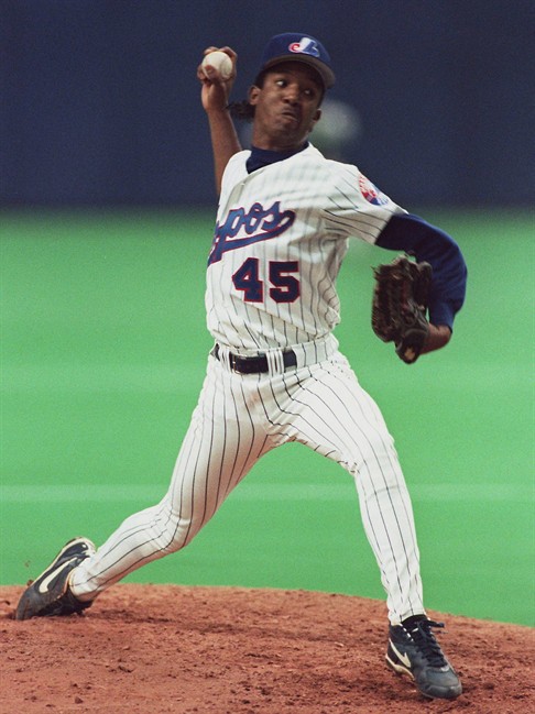 Montreal Expos pitcher Pedro Martinez fires a pitch against the Cincinnati Reds in Montreal, April 13, 1994. 