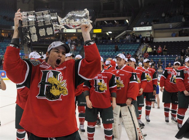 Halifax Mooseheads left winger Jonathan Drouin holds the Memorial Cup after the Mooseheads defeated the Portland Winterhawks in the finals of the 2013 Memorial Cup in Saskatoon, Sask., on Sunday, May 26, 2013. 