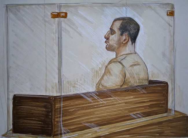 Reza Moazami is shown the prisoner's box in this court drawing.
