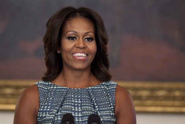 First lady Michelle Obama pausess during an event about food marketing to children in the State Dining Room of the White House on Wednesday, Sept. 18, 2013, in Washington.
