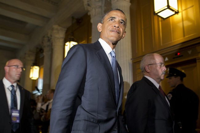 President Barack Obama, accompanied by Senate Sergeant at Arms and Doorkeeper Terrance Gainer, right, leaves a meeting with congressional Republicans on Capitol Hill in Washington, Tuesday, Sept. 10, 2013.