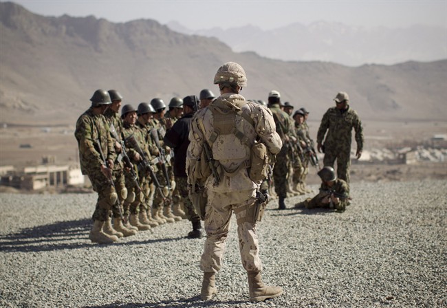 A Canadian soldier mentors a training session of Afghan National Army soldiers at the Kabul Military Training Center in Kabul, Afghanistan, March 7, 2012. 