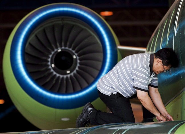 A worker assembles a Bombardier jet at the company's manufacturing facility in Toronto on May 29, 2012.
