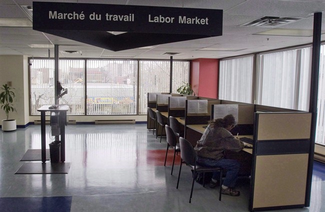 A man looks through jobs at a Resource Canada offices in Montreal April 9, 2009. 