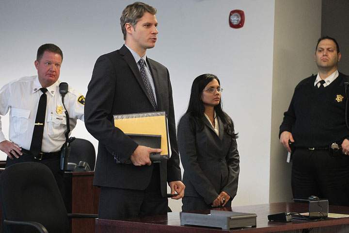  Former state lab chemist Annie Dookhan at Middlesex Superior Court. She is charged in connection with altering drug evidence during the testing process and obstructing justice. Here she stands with her attorney, Nick Gordon. (Photo by Suzanne Kreiter/The Boston Globe via Getty Images).