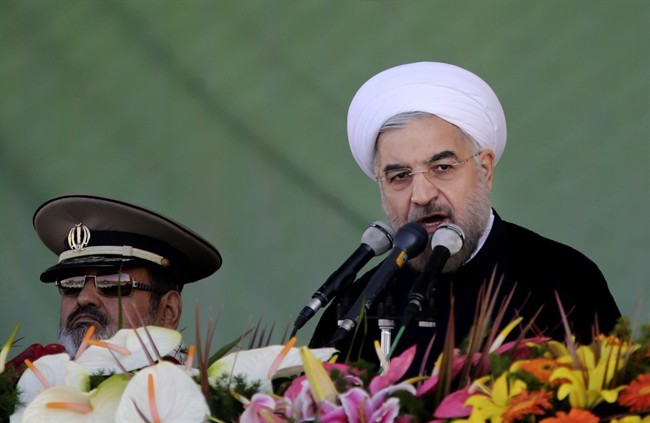 Iran's President Hassan Rouhani, gives a speech during an annual military parade in Tehran, Iran, Sunday, Sept, 22, 2013. 