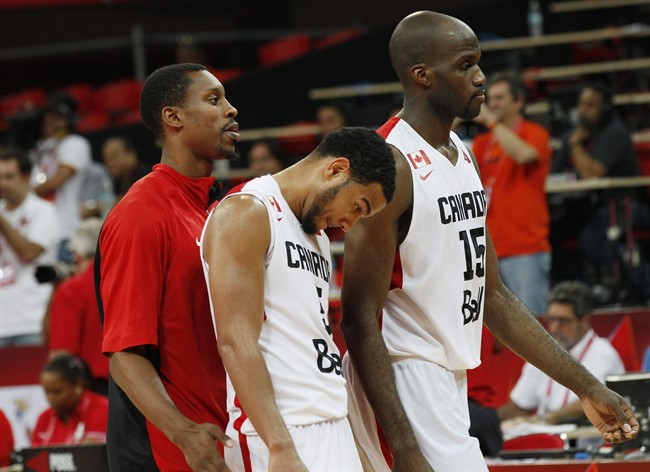 Canada's Cory Joseph, center, Joel Anthony, second right leave the field after they lost a FIBA World Cup qualifying basketball game in Caracas, Venezuela, Sunday, Sept. 8, 2013.