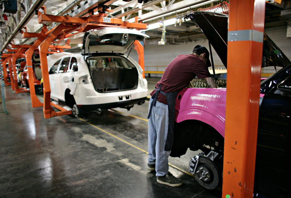 A Ford employee works on the line at an assembly facility June 3, 2008 in Oakville, Canada. 