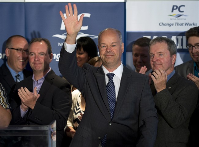Progressive Conservative leader Jamie Baillie waves to supporters as he delivers the party's platform in Halifax on Wednesday, Sept. 11, 2013.