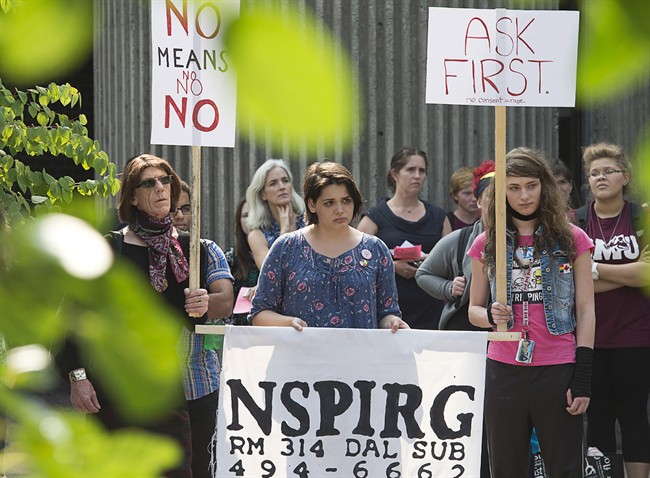Students attend a rally at Saint Mary's University to express their concerns over a chant that promoted rape culture during a recent school activity, in Halifax on Thursday, Sept. 12, 2013. The chant, captured on video and posted on social media, was sung at a frosh-week event for about 400 new students at the school.
