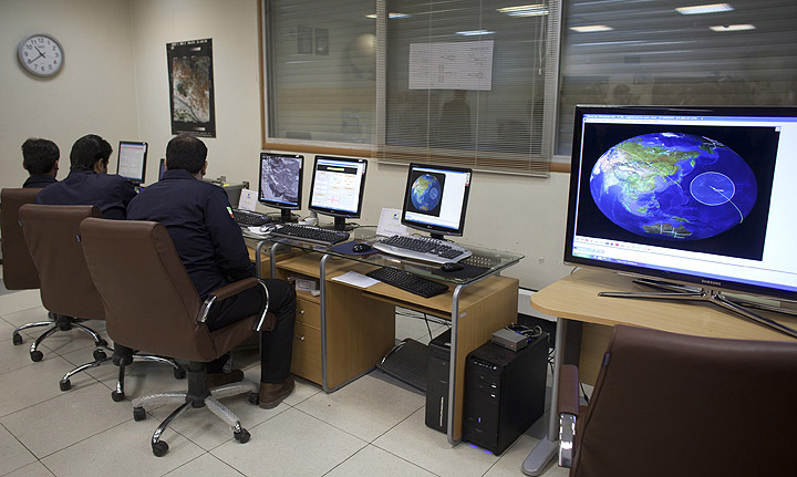 Personnel monitor the reception of Iranian satellite signals at the Alborz Station, as the media are given their first look inside a control center for the Islamic Republic's space program on February 29, 2012 in Mahdasht, 60 km west of the capital Tehran, Iran.