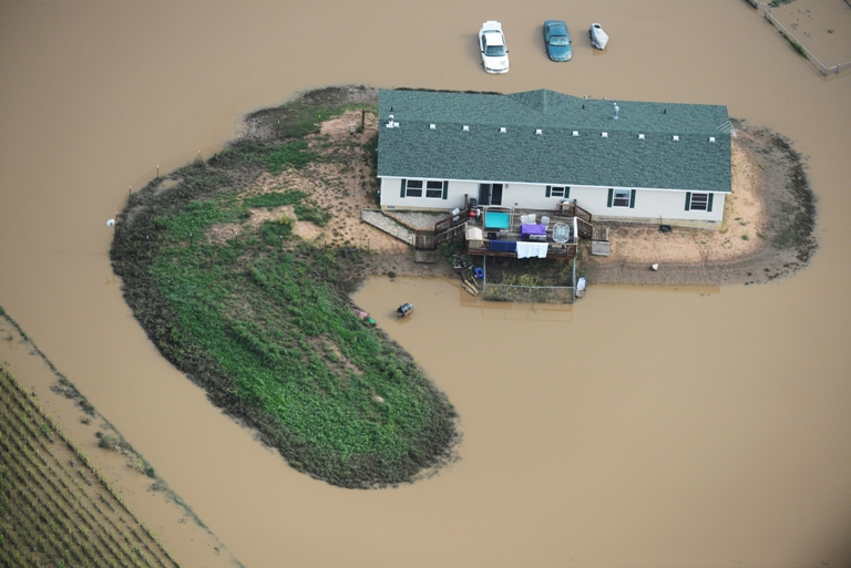 A home surrounded by flood water on a farm in Weld County Colorado Saturday morning, September 14, 2103. (Photo By Andy Cross/The Denver Post via Getty Images)