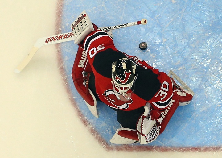 Martin Brodeur #30 of the New Jersey Devils has a puck sneak behind him in the game against the Montreal Canadiens at the Prudential Center on April 23, 2013 in Newark, New Jersey. 