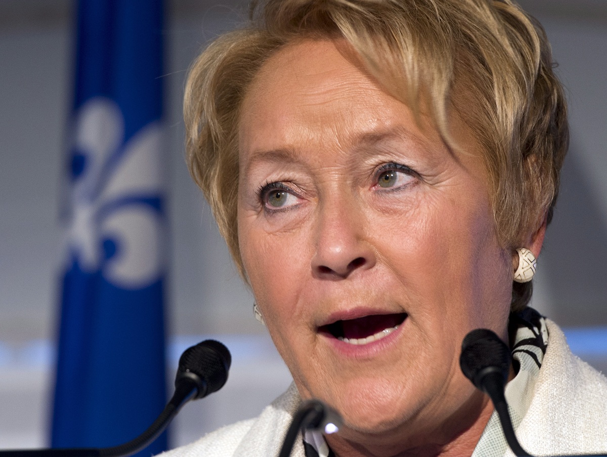 Security is heightened at the election night headquarters for Parti Quebecois leader Pauline Marois, pictured speaks at a news conference in 2013.