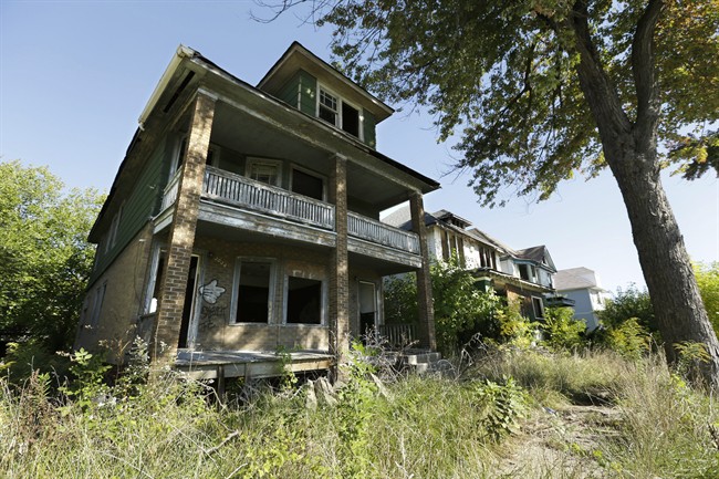 This photo shows a row of abandoned houses, Thursday, Sept. 26, 2013 in Detroit. Four of President Barack Obama's top advisers will converge on Detroit Friday to meet privately with state and local leaders about ways the federal government can help the bankrupt city short of a bailout. The White House said Thursday that top economic adviser Gene Sperling will join U.S. Attorney General Eric Holder, Transportation Secretary Anthony Foxx and HUD Secretary Shaun Donovan in the closed meeting. 