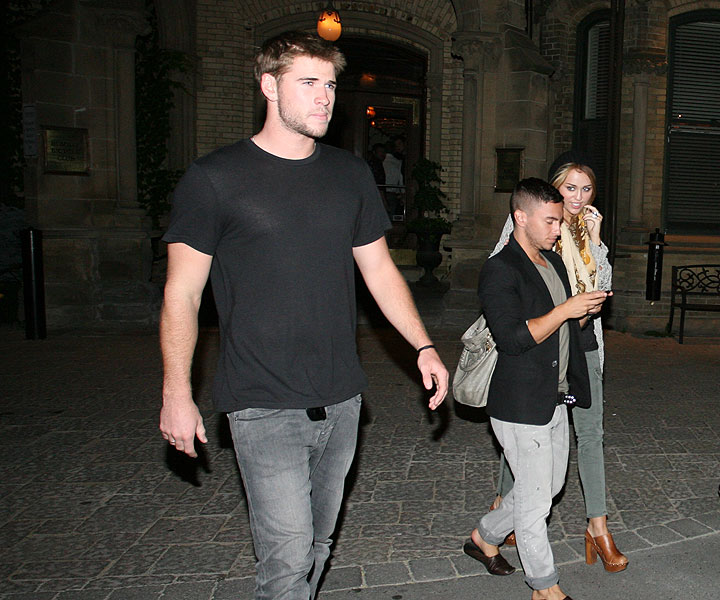 Liam Hemsworth and Miley Cyrus leave The Keg Mansion in Toronto in June 2010. (John R. Kennedy / Global News)