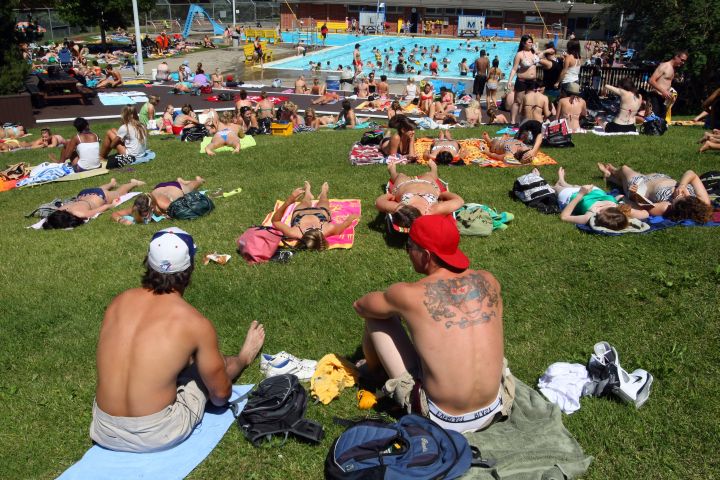 July 2010 photo of people enjoying the hot weather at the Mill Creek pool.