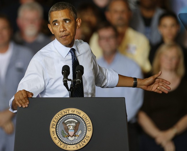President Barack Obama gestures as he speaks to workers at the Ford Kansas City Stamping Plant in Liberty, MO., Friday, Sept. 20, 2013. 