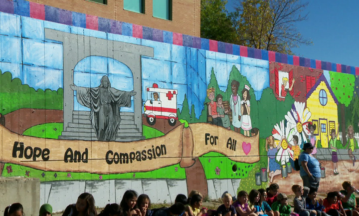 The mural in front of St. Paul’s Hospital showcases the many helping hands of the community.