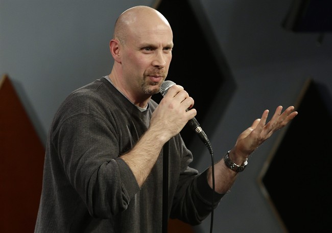 FILE - Vince A. Sicari, a South Hackensack, N.J., Municipal Judge, performs at Carolines on Broadway comedy clubin New York. taken in New York. New Jersey's Supreme Court on Thursday, Sept.19, 2013, ordered Sicari, a part-time municipal judge, to step down from the bench if he wants to continue moonlighting as a comedian and actor. Sicari said in an email that he would respond to the decision later Thursday. 