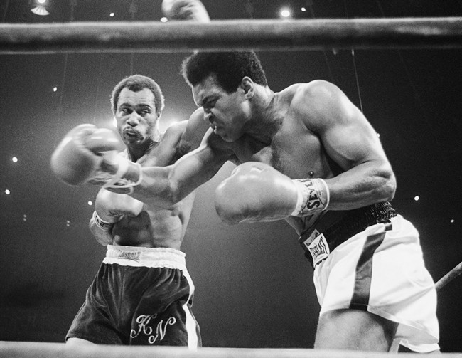 FILE - In this Sept. 10, 1973, file photo, Muhammad Ali, right, winces as Ken Norton hits him with a left to the head during their re-match at the Forum in Inglewood, Calif. Norton, a former heavyweight champion, has died, his son said, Wednesday, Sept. 18, 2013. He was 70.